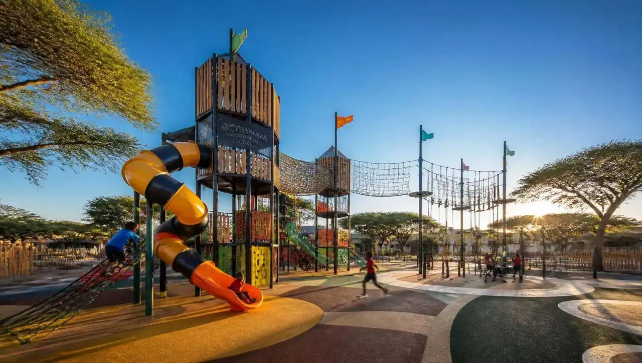 Children playing on a custom multi-tower jungle gym installed by Jungle City in Botswana